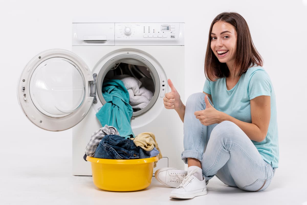 Woman doing laundry with washing machine